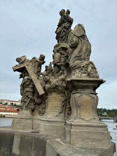 A statue of a person holding a cross

AI-generated content may be incorrect.