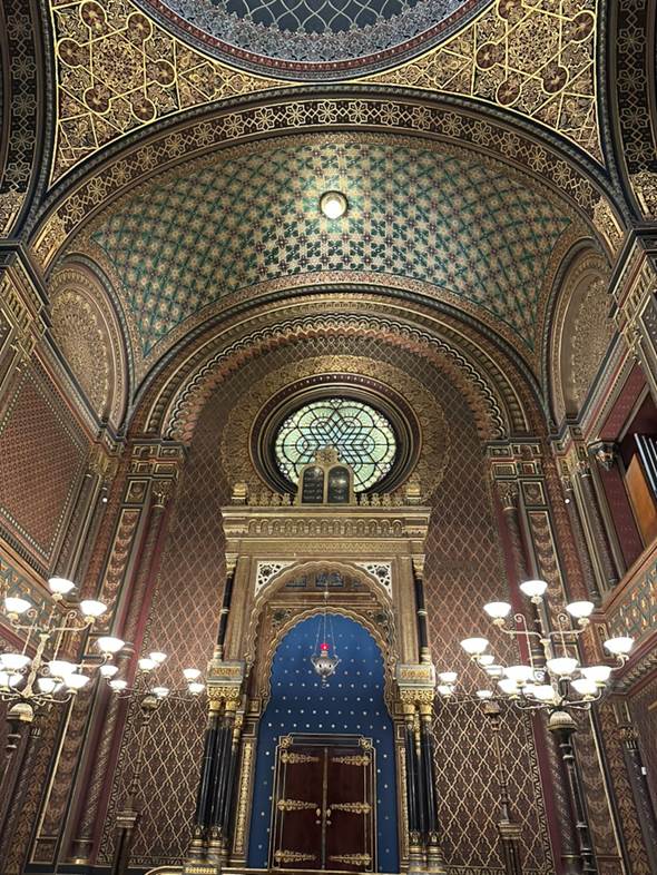 A ornate building with a stained glass window

AI-generated content may be incorrect.